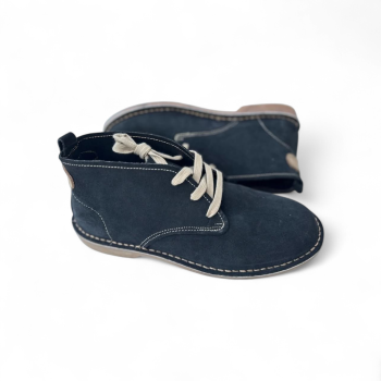 dark brown suede vellies with lace-up design and stitched sole on white background