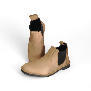 light brown leather chelsea boots with elastic side panels and slip-on design on white background